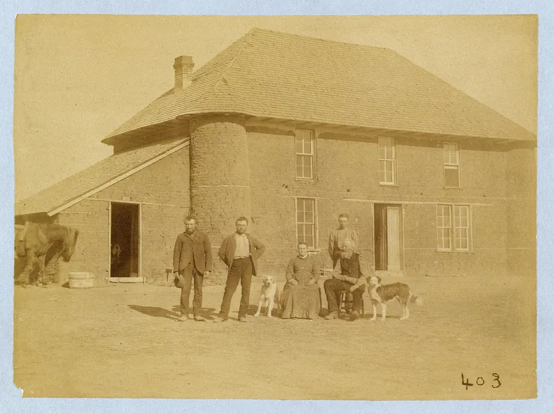The Isadore Haumont family before their unusual two-story sod house near Broken Bow, Nebraska, 1886