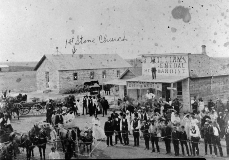 Black homesteaders of Nicodemus, Kansas, gathered before their church and general store around 1890